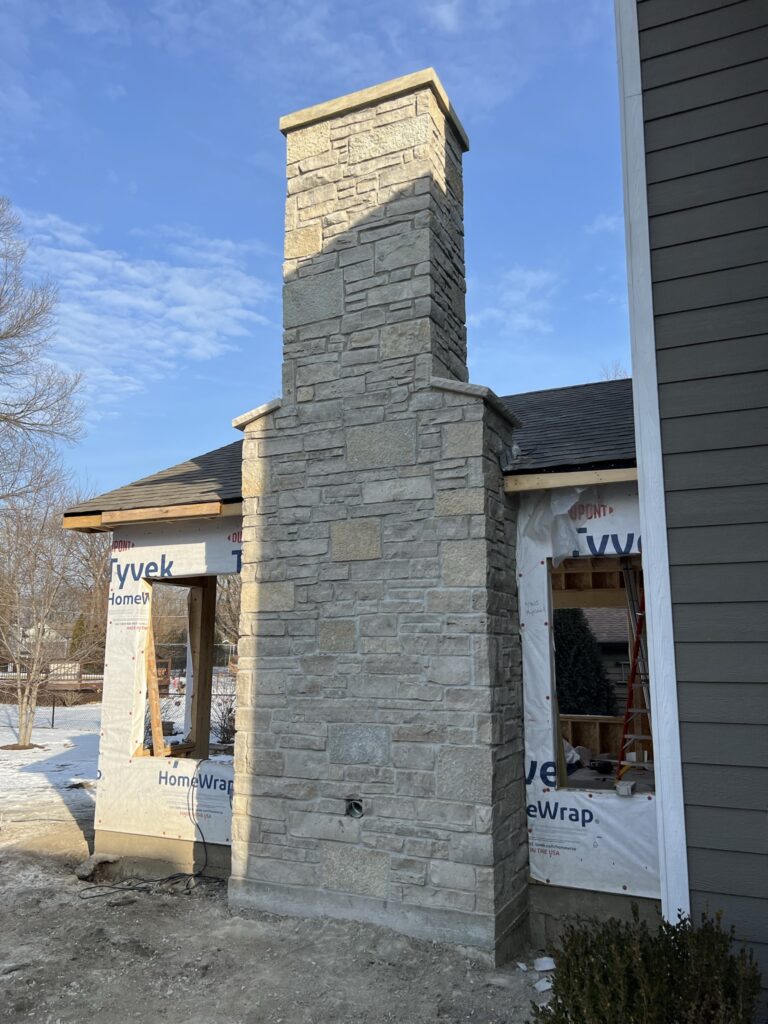masonry portfolio Naperville – custom stone chimney and fireplace construction by ADV Masonry on new residential home