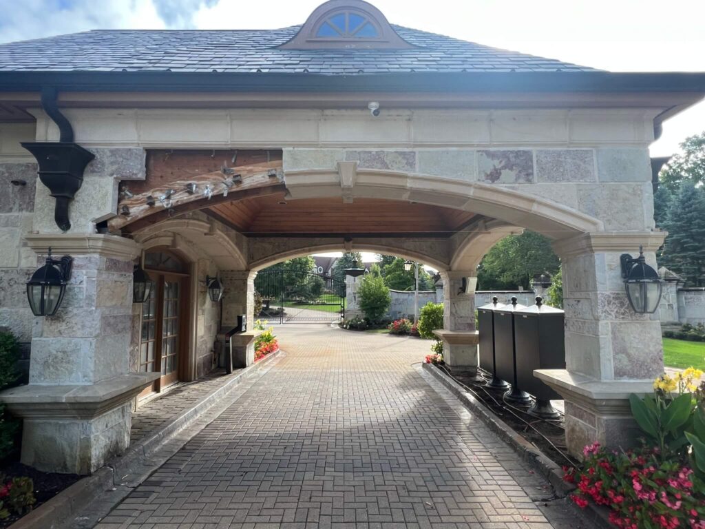 Adv Masonry performing brick restoration Naperville with cut stone repair on luxury home entryway