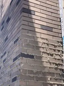 Adv Masonry performing chimney tuckpointing Naperville to repair failing mortar joints