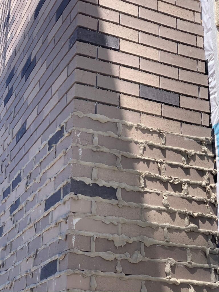 Adv Masonry performing chimney tuckpointing Naperville to repair failing mortar joints