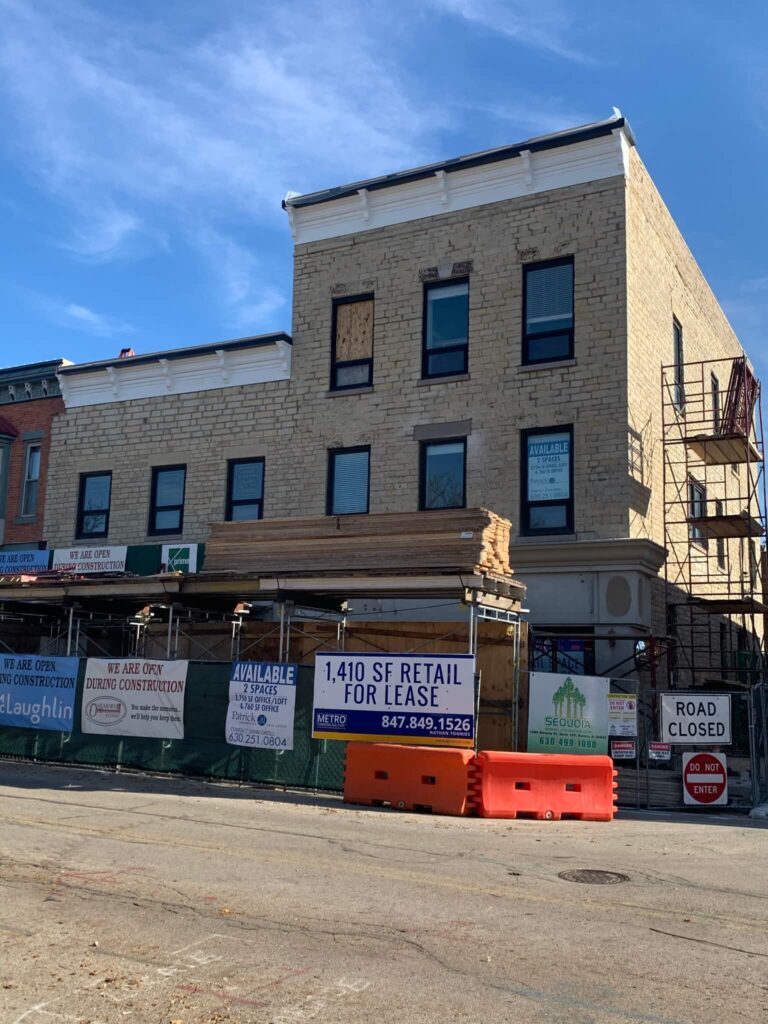Adv Masonry performing Naperville brick repair and tuckpointing on historic downtown Naperville mixed-use building