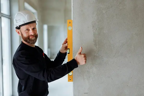 Professional mason giving thumbs up after precise work - Trusted Naperville Masonry Contractor