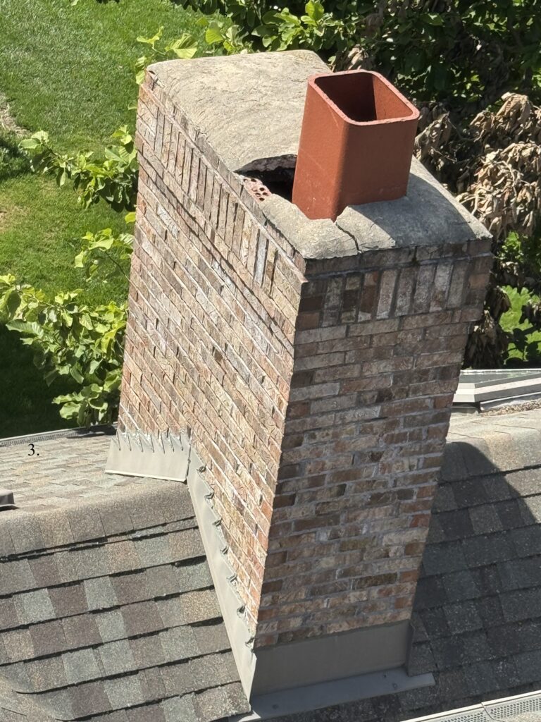 Cracked chimney cap and crown, needing chimney repair Naperville area by ADV Masonry.