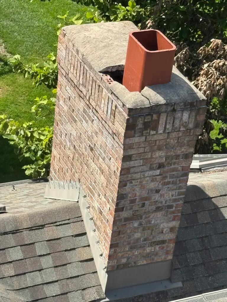 Cracked chimney cap and crown, needing chimney repair Naperville area by ADV Masonry.